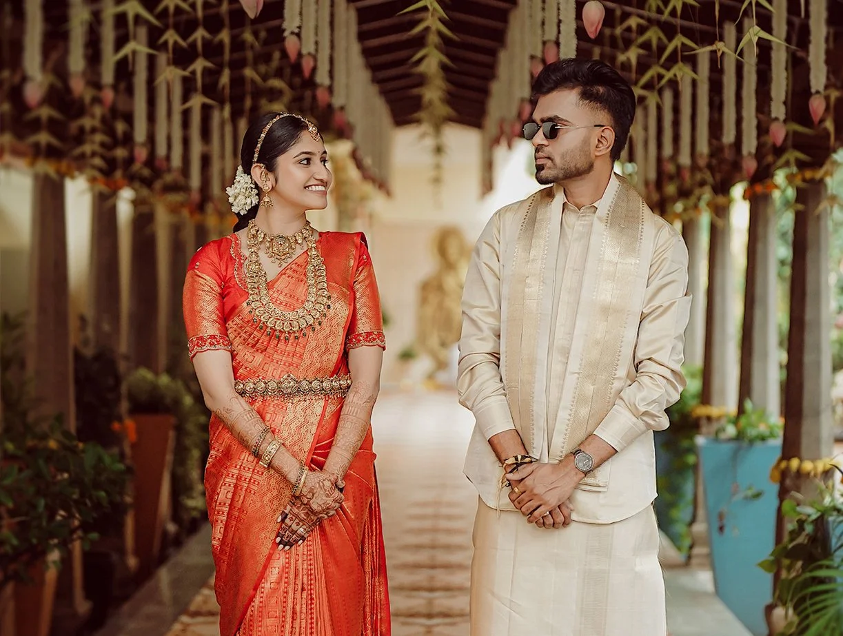 Guruvayur temple wedding couple in traditional Kerala attire smiling during ceremony